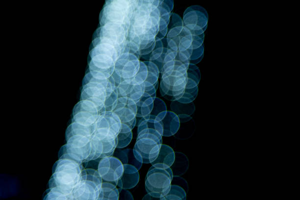 Defocused blue city bokeh lights on black