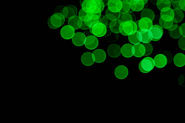 istock Defocused green city bokeh lights on black 1370980844