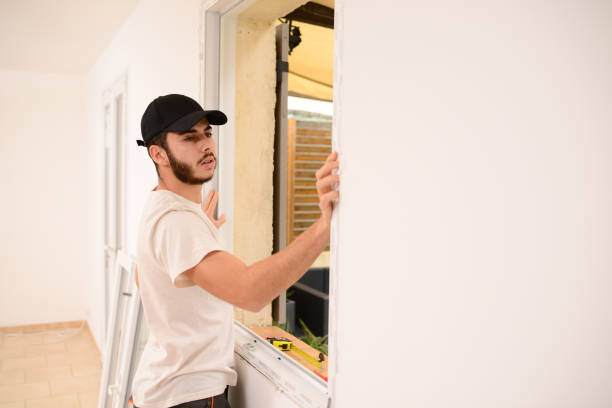 istock handsome young professional man installing and replacing a new home windows in client house for improvement energy saving efficiency isolation 1370984049