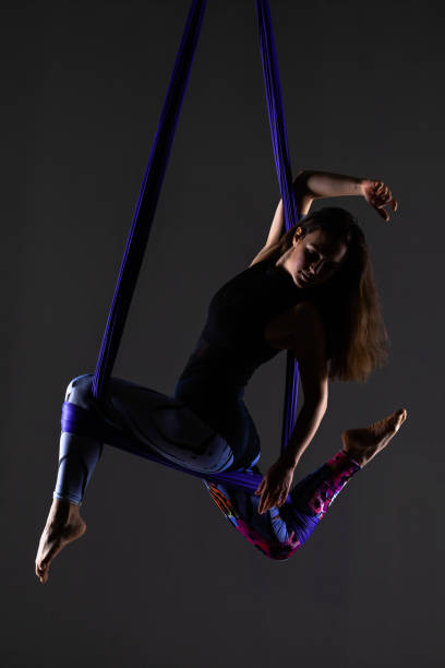 istock girl practicing aerial yoga 1370985555