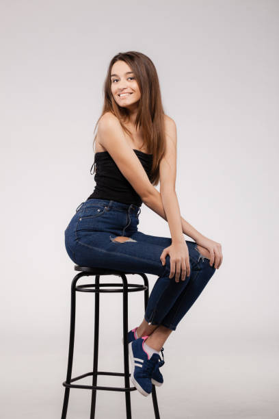 istock beautiful lady on a chair portrait 1370993581