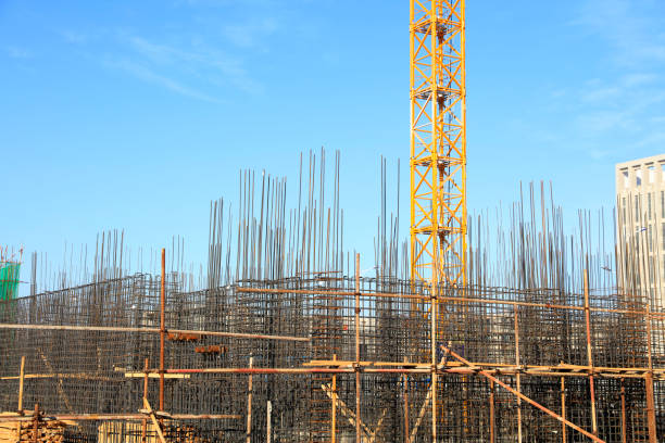istock the construction worker's tower crane, Residential buildings are under construction 1370994357