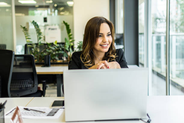 istock A smiling girl at her office desk 1370995572