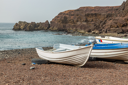 Boats on El Golfo Beach in Lanzarote, Canary islands.