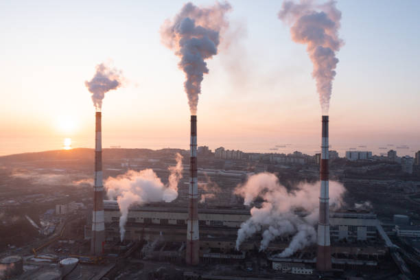 istock A factory with chimneys that emit smoke. 1370999953