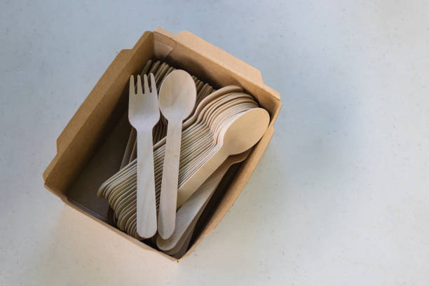 istock Wooden spoon and fork in paper box , disposable tableware , Eco-friendly materials 1371000133