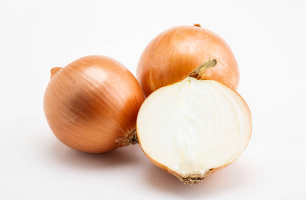 istock Pile of fresh onion and sliced on white background 1371000929