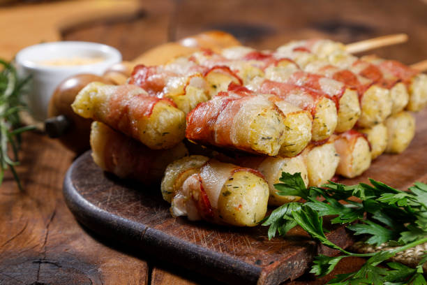 istock Cassava skewers wrapped in bacon, cassava medallion. 1371005437