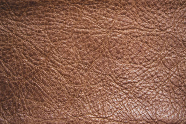 Genuine leather texture background. Dark brown, orange textures for decoration blank. Vintage skin natural suede with design line pattern or red abstract can use wallpaper or backdrop luxury event.