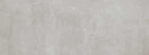 Warm white stone or cement concrete textured background