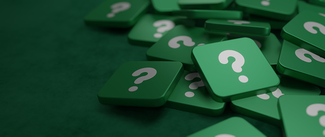 Green question mark on a background of white signs Concept of Asking Seeking for Knowledge