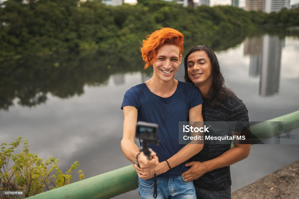 Influencer filming outdoors Influencer, Filming, Outdoors, Gay man, Day LGBTQIA People Stock Photo