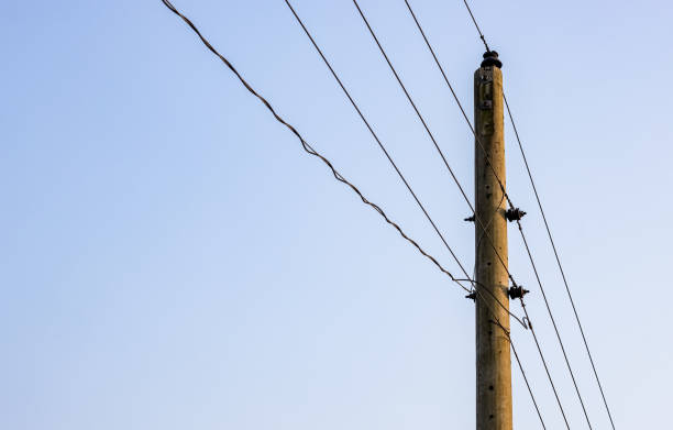 istock Old electricity pole under the blue sky with copy space 1371010286