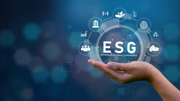 ESG Concepts on Environment, Society and Governance on technology palm with icon on blue background ESG Social Environment Press a button on the screen.