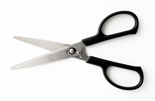 Overhead shot of opened black handle scissors, isolated on white with clipping path.