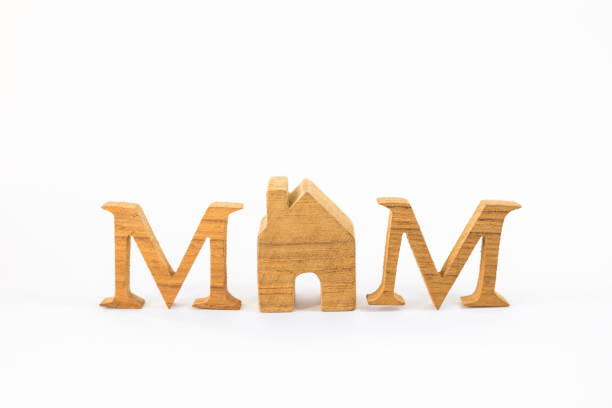 Wooden alphabet with house model isolate on white background, mom word, happy mother's day