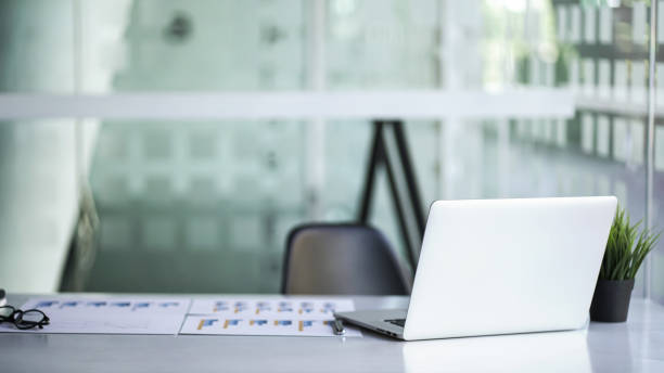 istock Close up laptop put on desk table in modern room. 1371022935