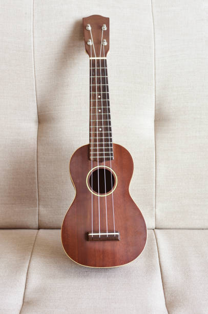 istock Ukulele on couch at home 1371023499