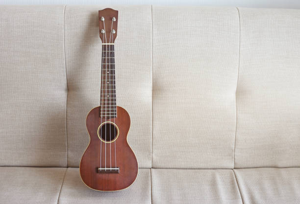istock Ukulele on sofa at living room 1371023501