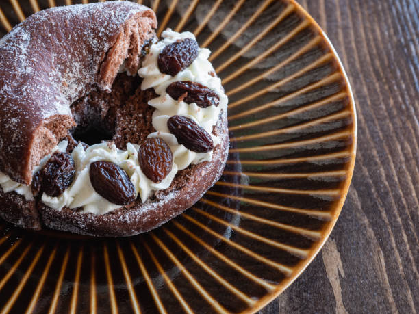 istock Donuts sandwiched between rum raisins and whipped cream. 1371023565