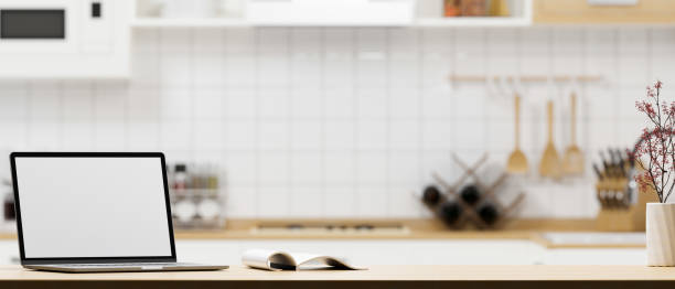 istock A portable laptop computer and copy space on modern wooden kitchen countertop 1371024085