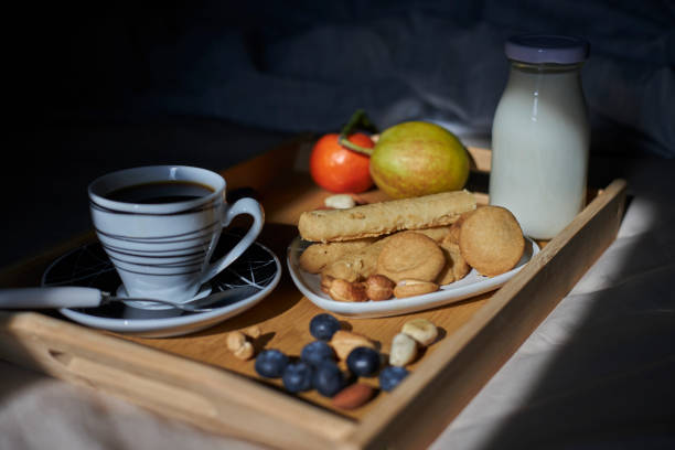 food and drink on bed in sunlight