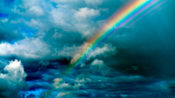 istock Rainbow after the rain on the background of the cloudy sky. 1371028190