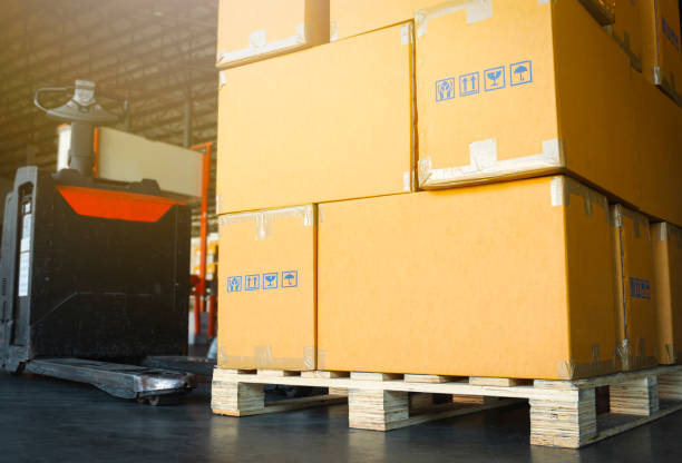 istock Packaging Boxes on Pallets Racks in Storage Warehouse. Supply Chain. Storehouse Shipment Goods. Distribution Warehouse Shipping Logistics. 1371028493
