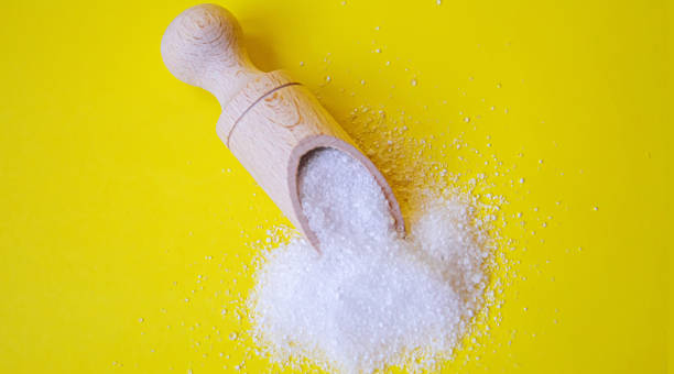 istock Citric acid on a yellow background. Selective focus. 1371028584