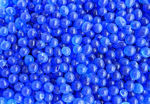 Pile of blue silica gel. blue silica gel texture background.