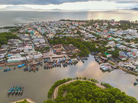 Aerial view of houses and fishing boats in Thanh An island, Can Gio - Vietnam. Beautiful nature. Travel concept