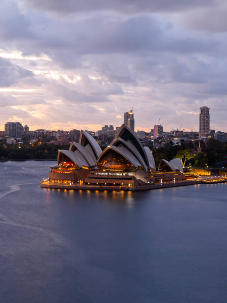 Sydney, Australia - February 12, 2022: Cloudy dawn view of Sydney Opera House.
