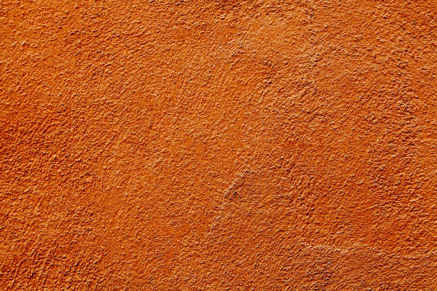 abstract orange stone wall pattern background texture - orange wall imagens e fotografias de stock