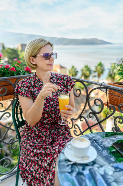 istock Woman enjoying the balcony 1371032754