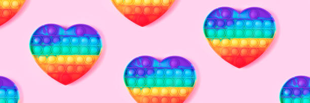 istock Banner from pop it toy isolated on pink background. 1371032878