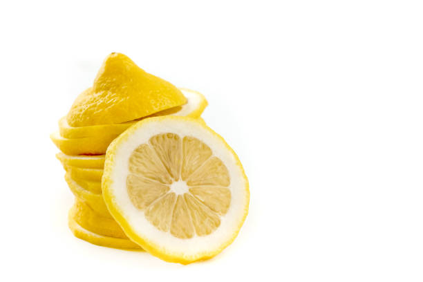 Yellow Lemon citrus half slices with leaf isolated on white background