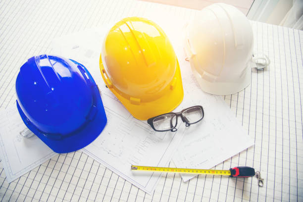 istock Architect at work in a construction site Engineers man construction safety work concept and construction city .Engineer Concept 1371035048