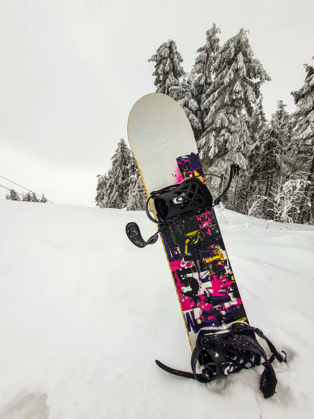 istock snowboard stick out from the snow 1371037275