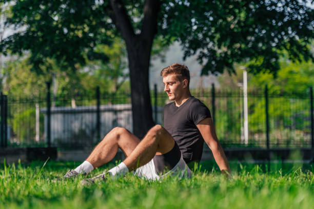 istock Athletic sportsman taking a break from a workout in the park 1371042863
