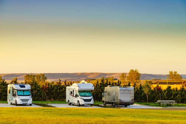 Camper rv camping on campsite in Santa Maria del Campo town, province of Burgos, Spain. Travel with motor home.
