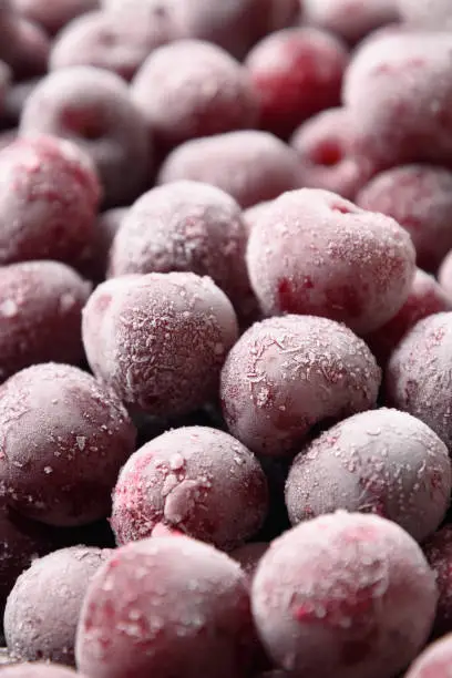 Photo of Frozen red sour cherry as berries summer refreshing background.