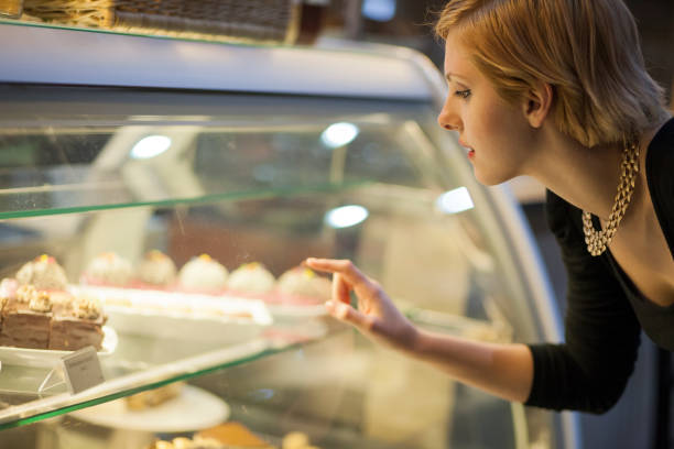 istock Young woman looking at sweets 1371047926