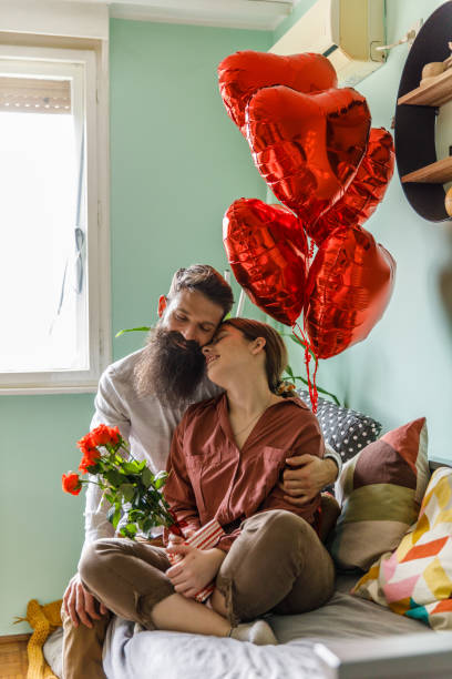 istock Romantic couple celebrating Valentine's day cuddling 1371054999