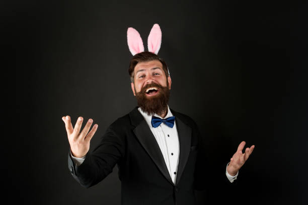 istock Celebration Easter holiday. Easter day. Event host. Celebrate Easter. Let me be your bunny. Bearded man with long ears. Businessman with long ears. Handsome man wear bunny costume accessory 1371055741