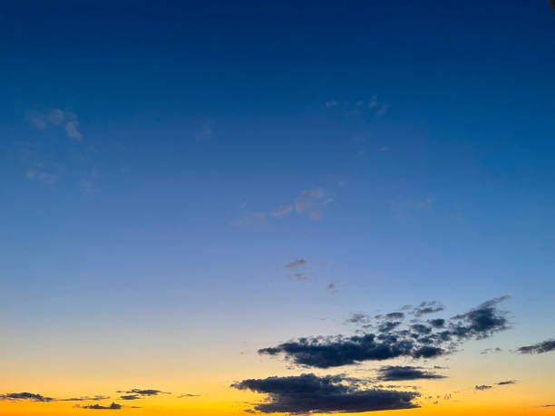 Sunset on blue sky. Blue sky with some clouds. Beautiful sunset. stock photo