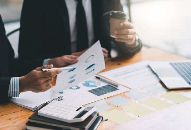 istock Partner colleagues are talking about the results in the document on hand and together analyze the work data about the company's financial statements. 1371058565