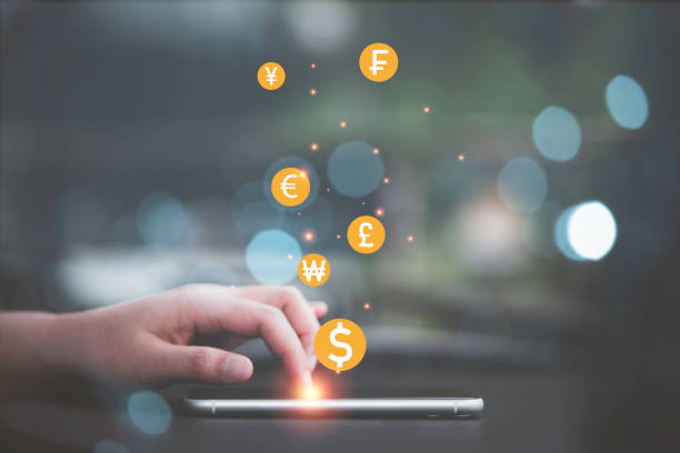 istock Hand using smartphone with currency icon include dollar Yen yuan Euro and Pound sterling for internet banking and trading currency exchange or forex concept. 1371059206