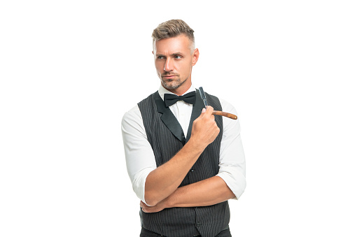 man barber with razor blade in bow tie isolated on white background.