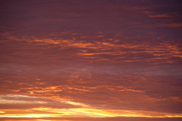 istock Bright colorful sunset sky with rays of setting sun and vivid dark clouds 1371060008