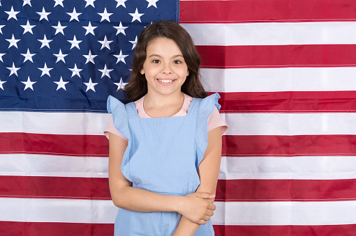 Let freedom reign. Independence is happiness. Independence day holiday. Americans celebrate independence day. Little girl with USA flag. Study english language. Education abroad. Patriotic upbringing.